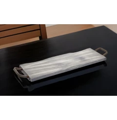 black wood metal serving tray with handles on hardwood surface