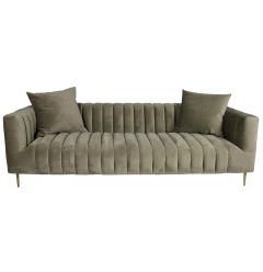 Brown velvet gold sofa with toss pillows in a comfortable studio couch design