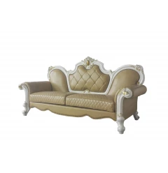 Leather pearl sofa with five toss pillows and wood accents in a comfortable studio setting
