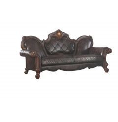 Brown faux leather sofa with toss pillows and wooden accents