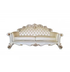 Leather pearl sofa with five toss pillows in a natural material beige color with wood accents