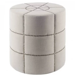 Cream linen round footstool ottoman with beige leather and metal accents in a fashion accessory style