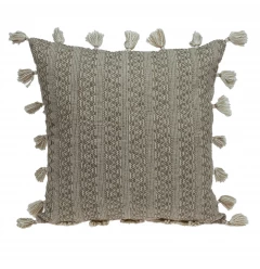Neutral sand woven throw pillow with patterned design and artistic fabric texture