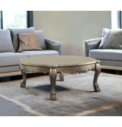 54" Gold And Bone Solid And Manufactured Wood Coffee Table