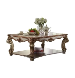 58" Gold Solid And Manufactured Wood Coffee Table With Shelf
