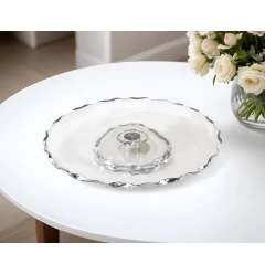 silver tableware drinkware dishware with flower and plate on table