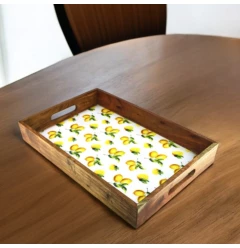 solid wood lemon serving tray with handles on a rectangular hardwood table