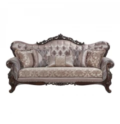 Imitation silk sofa with five toss pillows in a comfortable brown studio couch setup