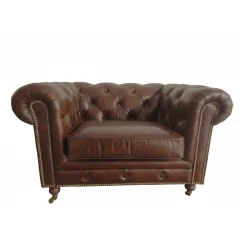 Brown leather sofa with hardwood armrests and natural material