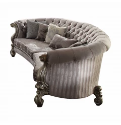 Platinum upholstery poly resin sofa pillows on a brown studio couch with armrests for outdoor comfort