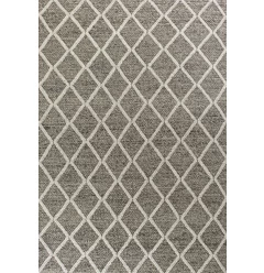 woven diamond pattern indoor area rug on beige flooring