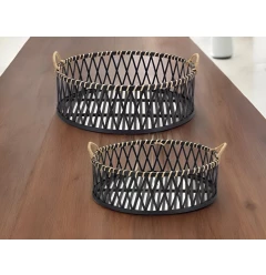 tan round bamboo serving tray with handles on wooden table