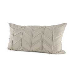 Gray chevron textured lumbar pillow cover on beige wood with natural material accents