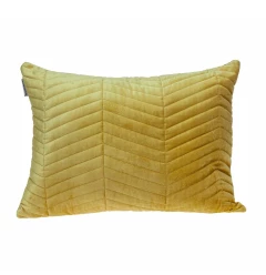 Velvet zig zag pattern decorative lumbar pillow on wood with textured linens