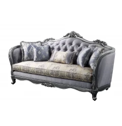Silk platinum sofa with five toss pillows in a comfortable hardwood studio couch setting