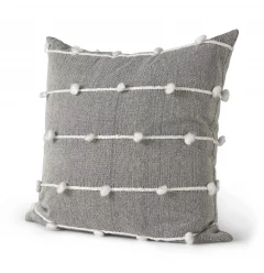 Dark gray detailed pillow cover with pattern on wooden chair