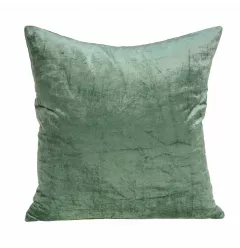 Green solid throw pillow cover with poly insert on couch