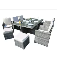 Gray outdoor dining cushions on a rectangle table with matching chairs