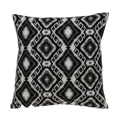 Jet black and white geometric pattern throw pillow on couch