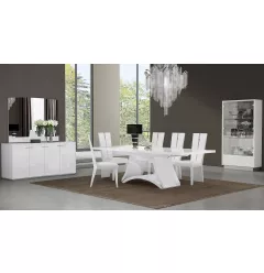 Seven white dining chairs set with rectangle wood table and plant decor