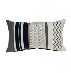 Boho geo braid lumbar pillow on couch with decorative throw pillow and linens