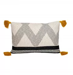 Beige black knit throw pillow with a textured pattern on a basket weave background
