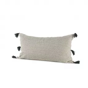 Dark green dotted lumbar pillow cover on wooden surface with textured design