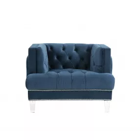Blue velvet black tufted arm chair with comfortable armrests and elegant design