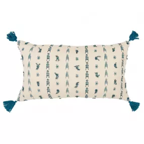 Beige tribal-inspired tasseled lumbar pillow with pattern design on linens