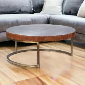 36" Brown And Silver Leather And Metal Round Coffee Table