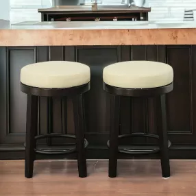 Set of Two 24" Cream And Espresso Faux Leather And Solid Wood Swivel Backless Counter Height Bar Chairs