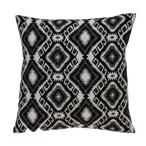 Jet black and white geometric pattern throw pillow on couch
