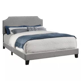 Gray Standard Bed Upholstered With Nailhead Trim And With Headboard