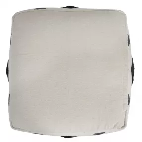 White cotton ottoman with beige fashion accessory and serveware elements