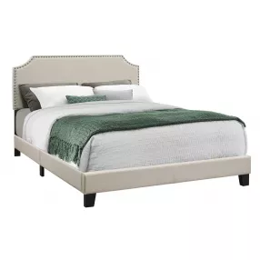 Beige Standard Bed Upholstered With Nailhead Trim And With Headboard