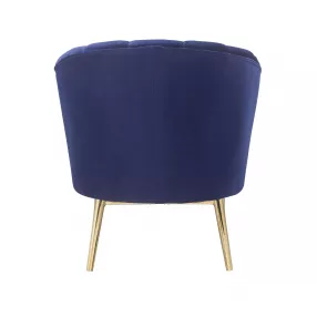 Blue copper velvet tufted barrel chair with wood accents and plush upholstery in electric blue shade
