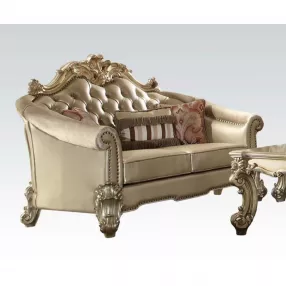 67" Bone And Gold Faux Leather Loveseat and Toss Pillows