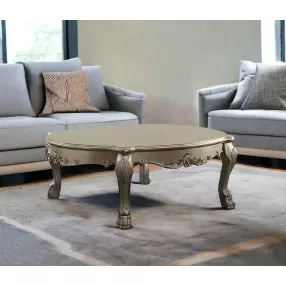 54" Gold And Bone Solid And Manufactured Wood Coffee Table