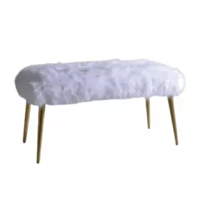 White gold upholstered faux fur bench with electric blue and magenta accents in an outdoor setting