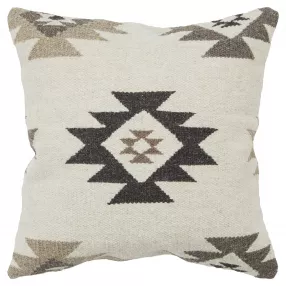 Beige classic ikat pattern throw pillow on grey textile background