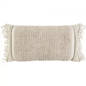 Handwoven braided stripe macrame fringe lumbar pillow with woolen pattern on wooden background