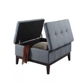 Slate blue linen tufted storage bench with armrests and wood accents in outdoor setting