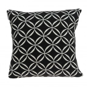 Transitional black pillow cover with poly insert featuring rectangle pattern and plant accents