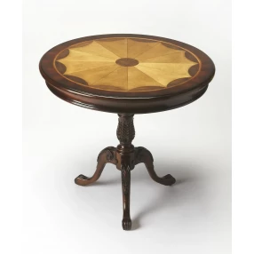 Brown round coffee table with wood and metal elements near a window
