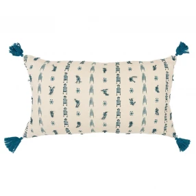 Beige tribal-inspired tasseled lumbar pillow with pattern design on linens