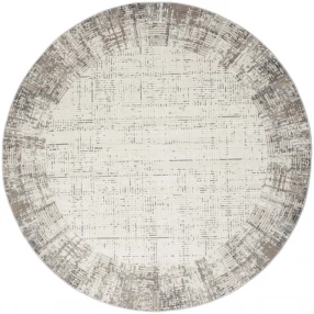round abstract power loom area rug with beige pattern and circular design