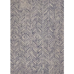 hand tufted herringbone indoor area rug in brown purple and grey on wood flooring