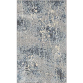 blue floral power loom area rug with grey rectangle pattern on wood surface
