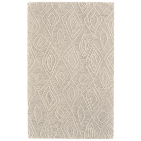tufted handmade stain resistant area rug in brown and beige with a symmetrical pattern