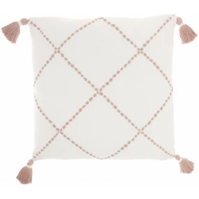 Blush pink cotton accent throw pillow with a textured pattern on a beige background